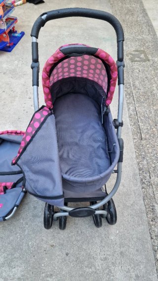 Cochecito de juguete para muñecas