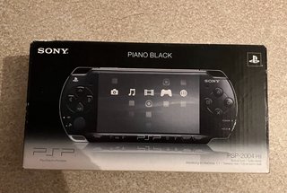 PSP Slim + scatola + base + schede + cavi per TV