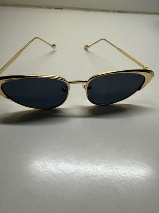 Gafas de sol doradas y negras mujer