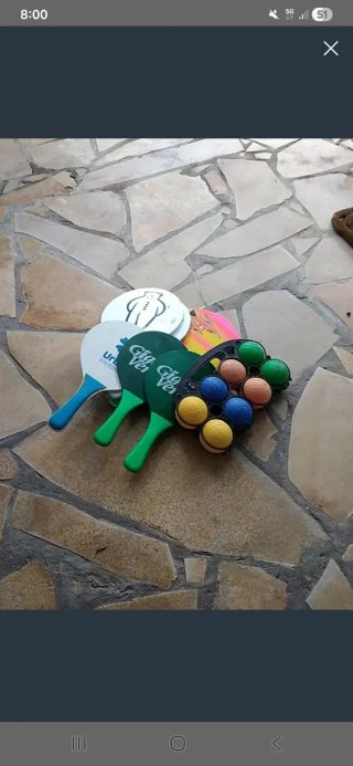 Juego de palas y pelotas para playa
