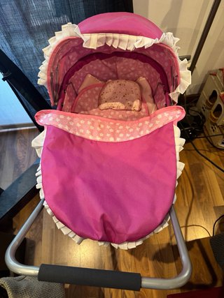 Cochecito de juguete rosa para bebé