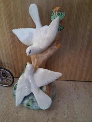 Lote figuras porcelana: niño, bicis, cactus, palom