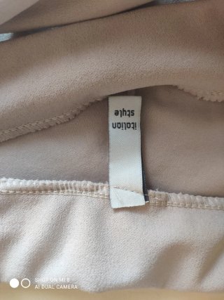 Pantalón campana beige con cinturón
