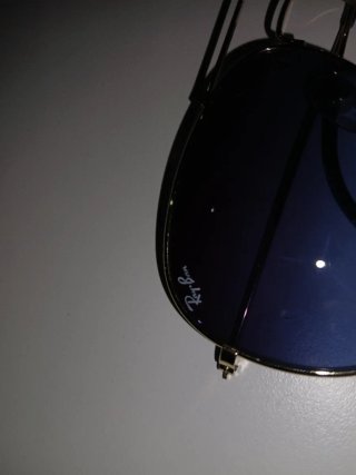 Gafas de sol Ray-Ban doradas y azules