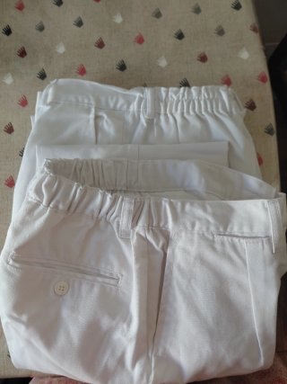 2 Pantalones blancos largos Sanfermines, talla 38.