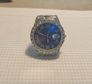 Reloj plateado con correa de eslabones