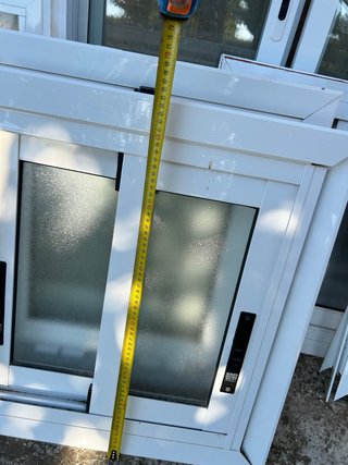 Ventana corredera con envellembellecedor
