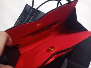 Bolso de noche Balenciaga negro y dorado
