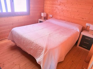 Casa de madera con piscina