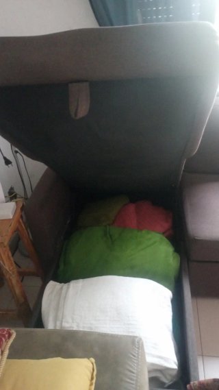 Sofá cama gris de tela