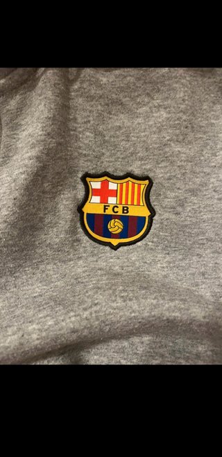 Sudadera Nike gris con logo FC Barcelona