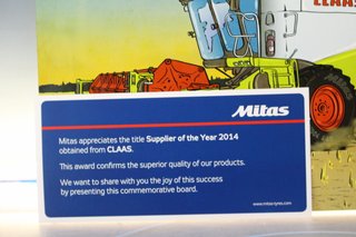 Cartel, chapa metálica y porcelana “Half of Europe harvest with Mitas. Claas”. 2015. Original.