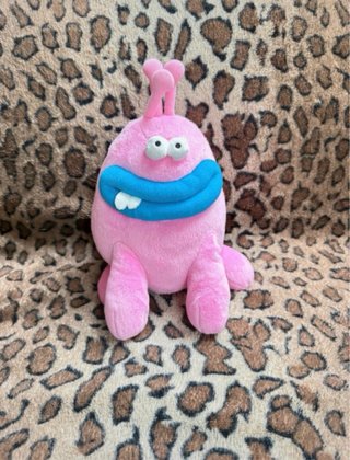 Peluche mostro blu, rosa e giallo