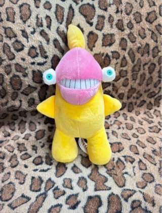 Peluche mostro blu, rosa e giallo