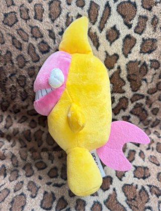 Peluche mostro blu, rosa e giallo