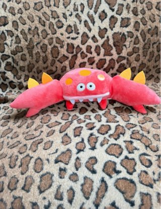 Peluche mostro blu, rosa e giallo