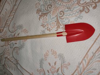 Pala infantil roja para playa
