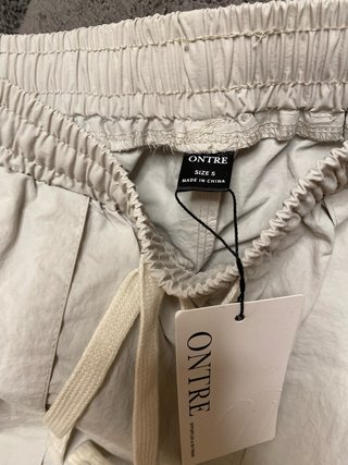 Pantalón impermeable ONTRE beige talla S
