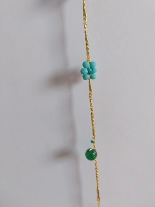 Collana uncinetto oro e pietre verdi