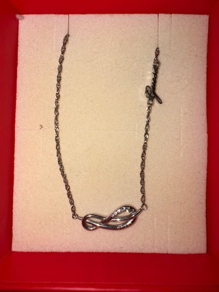 Conjunto collar y pulsera Guess plateado