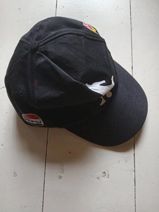 Cappellino nero con visiera uomo. Pepsi. T. Única