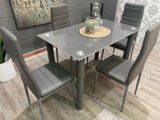 Mesa cristal con 4 sillas polipiel