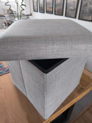 Puff plegable gris tela