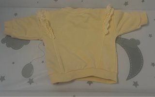 Sudadera bebé amarilla con volantes