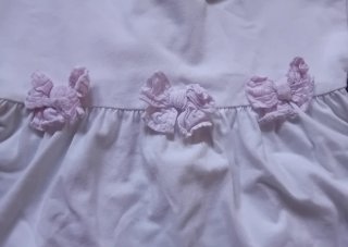 Maglietta bambina bianco con fiocchi rosa