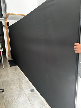 Toldo retráctil de tela negro