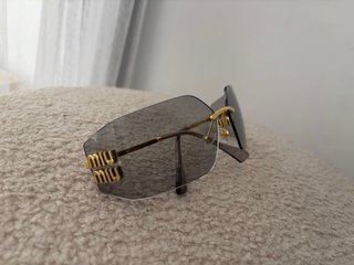 Gafas de sol Miu Miu doradas y grises