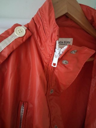 Hello Kitty.Chaqueta M Rojo naranja y lámpara led