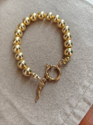 Bracciale con charm cornetto oro