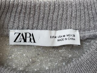 Jersey gris con perlas
