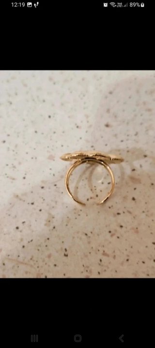 Anello fiore in acciaio dorato