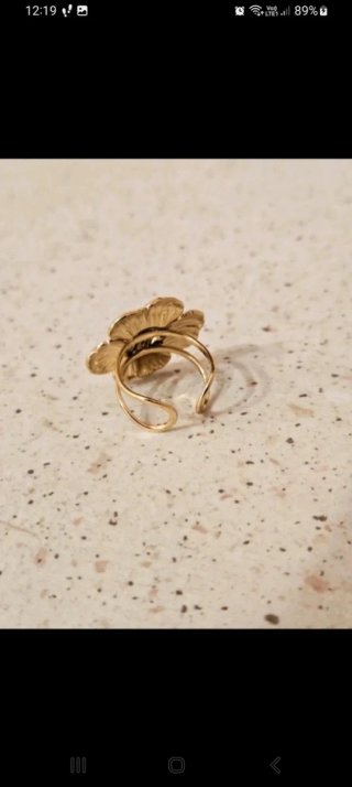Anello fiore in acciaio dorato