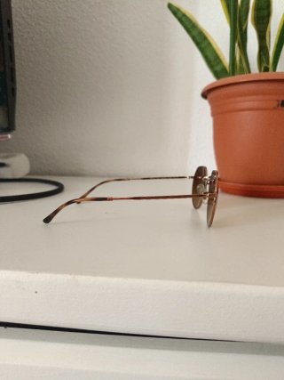 Gafas de sol Ray-Ban doradas y marrones