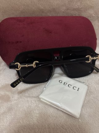 Gafas de sol Gucci negras y marrones