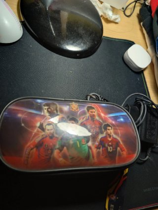 PSP Negra con Cámara y Juegos Lee Descripción