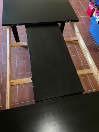 Mesa de comedor de madera negra extensible