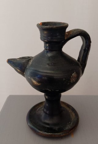 Lucerna antica in terracotta verniciata nera