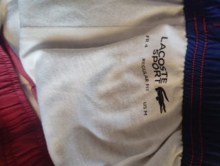 Pantalón deportivo Lacoste rojo y azul