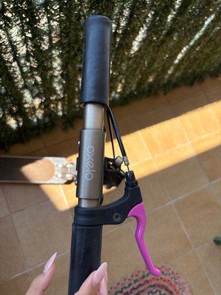 Patinete rosa y negro Oxelo