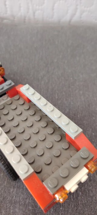 Lego trattore rosso con rimorchio
