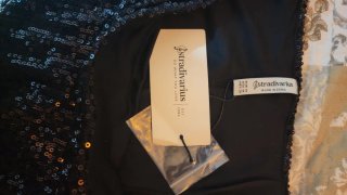 Falda Stradivarius lentejuelas negra T.M