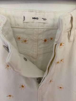 Pantalón blanco estampado margaritas Mango