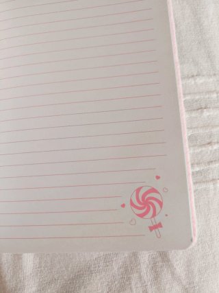 Cuaderno con pompón