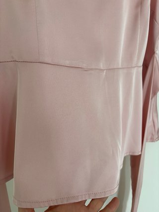Blusa rosa peplum con lazo