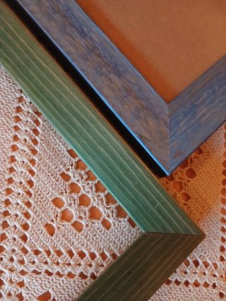 Cornici in legno blu e verdi