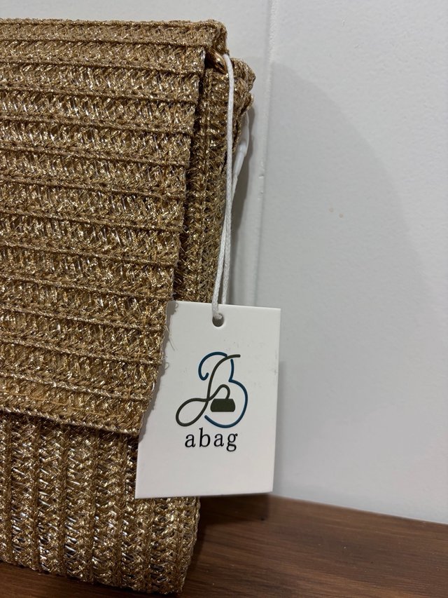Bolso Clutch Dorado Tejido con Cadena